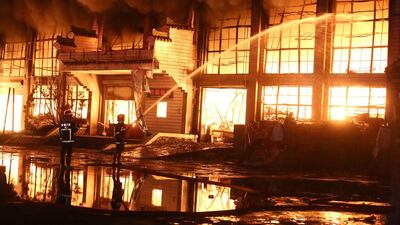 Rescuers tackle a blaze at a building in Huangshan, Anhui Province, China. Reuters