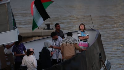Swedish climate activist Greta Thunberg, right, on board a vessel of a civilian flotilla carrying humanitarian aid for Gaza, after being forced to return to Barcelona by bad weather. AFP