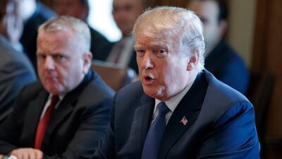 Acting Secretary of State John Sullivan listens as President Donald Trump speaks during a cabinet meeting at the White House on April 9, 2018. Evan Vucci / AP Photo