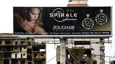 Nationals of countries including the UAE and Saudi Arabia have been told not to travel to Beirut due to security concerns. Above, an advertisement billboard between war ruins in Beirut. Patrick Baz / AFP