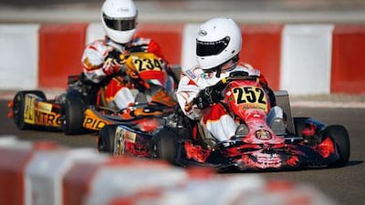 Go-karters on the Al Ain Raceway take part in the UAE Rotax Max Challenge race last month.