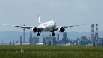 A Boeing 777. The US plane maker will soon launch versions with folding wing tips. Heinz-Peter Bader/Reuters
