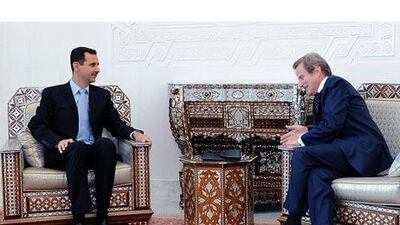 The Syrian president Bashar Assad, left, meets, with France's foreign minister Bernard Kouchner, right, at the Syrian presidential palace in Damascus.