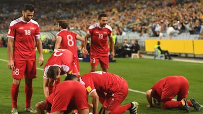 Syria's players celebrate after teammate Omar Alsoma scored the opening goal. Dean Lewins / EPA