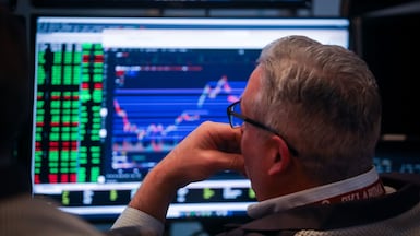 A trader works on the floor of the New York Stock Exchange. Stocks opened the new year on a positive note. Bloomberg