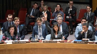 U.S. Ambassador to the United Nations Nikki Haley, center, votes in favor of a resolution introduced by the United States during a Security Council meeting on the situation between the Israelis and the Palestinians.