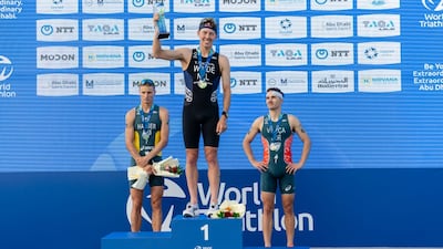 Hayden Wilde on the podium after winning the World Triathlon Championship Series opener at Hudayriyat Island. Photo: World Triathlon