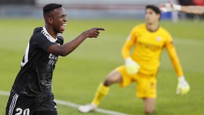 Real Madrid's Vinicius Jr celebrates his team's winner - courtesy of an own goal - against Sevilla at the Sanchez Pizjuan Stadium on Saturday, December 6. EPA
