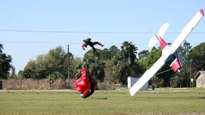 The parachutist is thrown clear as the plane nosedives into the ground. Tim Telford / AP Photo / March 8, 2014
