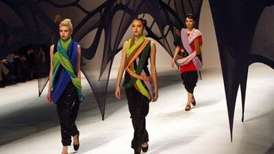 Issey Miyake (left) made several scarves do the work on one top