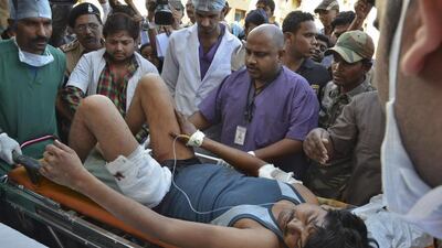 An injured Indian paramilitary soldier is taken to a hospital at Raipur in Chhattisgarh state after Maoist rebels ambushed police and killed 20. Reuters / March 11, 2014
