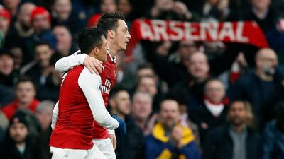 Alexis Sanchez, left, and Mesut Ozil are nearing the end of their respective contracts. Kirsty Wigglesworth / AP Photo