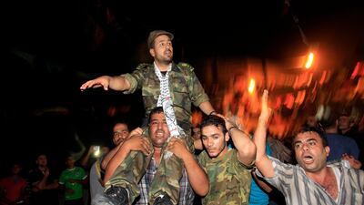 Freed Palestinian prisoner Salah al-Sahair, who was held by Israel for 21 years, celebrates as he arrives at his family's house in Khan Younis. AFP PHOTO / SAID KHATIB