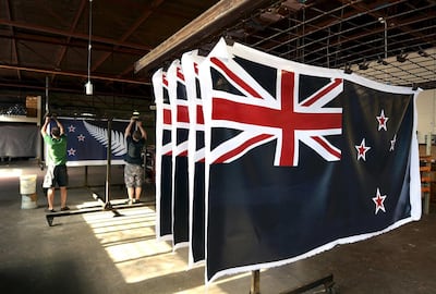 New Zealand voters chose to keep the current design of their national flag, right, instead of adopting the new design with a silver fern, in a referendum that ended on March 24, 2016. Reuters