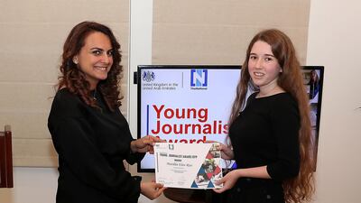 Mina Al-Oraibi, editor-in-chief of 'The National', presents Matilda Rice with her UAE Young Journalist Award. Pawan Singh / The National