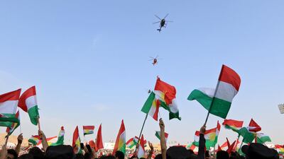 Helicopters fly over Iraqi Kurds celebrating in support of the upcoming September 25 independence referendum, in Dohuk on September 16, 2017. Ari Jalal / Reuters