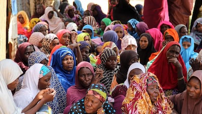 Women gather during a burial ceremony, after two people were killed by Boko Haram fighters in Dalori camp for internally displaced people, near Maiduguri, on July 26, 2019. AFP
