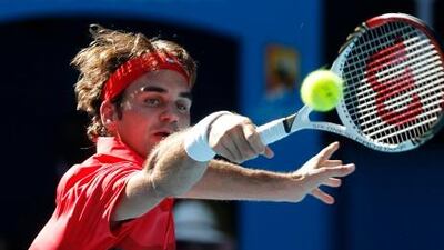 Roger Federer hits a backhand in his quarter-final match against Juan Martin Del Potro.
