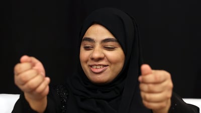 Maryam Al Dhanhani makes a point during a meeting in Abu Dhabi. She is keen that people in the UAE watch her compete and are inspired to take up sport to change their lives. Chris Whiteoak / The National