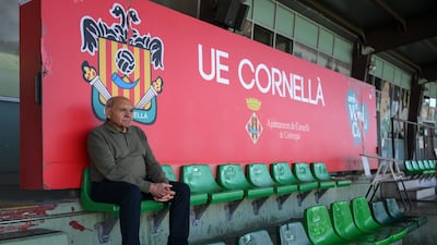 A Cornella fan attends a training session at Estadio Municipal Cornella. Lionel Messi has acquired the club. Getty Images