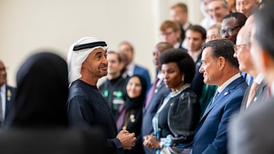 President Sheikh Mohamed receives global health leaders on Tuesday. Ryan Carter / UAE Presidential Court