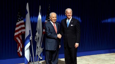 Israel's President Shimon Peres shakes hands with U.S. Vice President Joe Biden before their meeting at the president's residence in Jerusalem March 9, 2010. Reuters