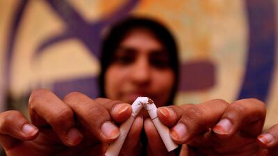 Dr Wedad Al Maidoor, head of the Ministry of Health’s National Tobacco Control Programme, shows what she thinks of cigarettes. Dr Al Maidoor is encouraged by the survey results. Paulo Vecina / The National