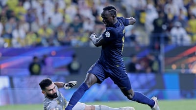 Al Nassr forward Sadio Mane attempts to round Al Khaleej goalkeeper Marwan Al Haidari. Reuters