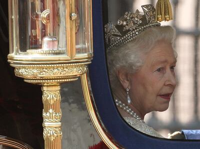 Queen Elizabeth II wears the Diamond Diadem as she returns to Buckingham Palace after attending the State Opening of Parliament. PA