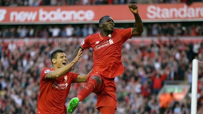 Christian Benteke celebrates scoring against Bournemouth in Liverpool's Premier League win on Monday night. Clint Hughes / AP / August 17, 2015