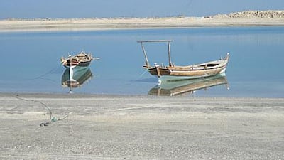 Visions of yesterday: Two boats await visitors wanting to experience life as fishermen or pearl divers.
