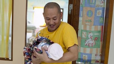 One-day-old baby girl Simone Therese Amora, born 57 minutes after midnight on December 2, 2012, was one of the first babies born on National Day in the Corniche Hospital, Abu Dhabi. Silvia Razgova / The National