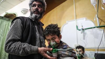 An affected child receives treatment after a gas attack on al-Shifunieh village, in Eastern Ghouta, Syria, 25 February 2018. EPA/MOHAMMED BADRA