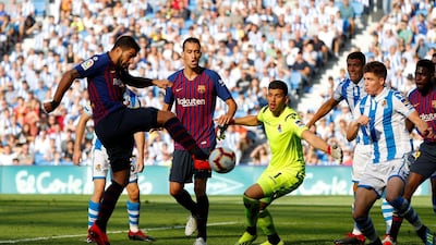 Barcelona's Luis Suarez scores Barcelona's first goal. Reuters