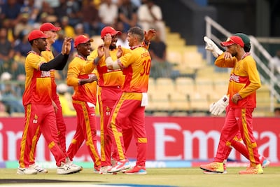 Graeme Cremer of Zimbabwe, centre, celebrates taking the wicket of Pathum Nissanka of Sri Lanka. Getty Images