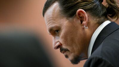 Depp insists he was never violent with his former wife and has never hit a woman. AP