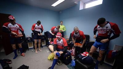 Russia's rugby union players get dressed in the locker room prior to their match against Crimea rugby union on Saturday. Filippo Monteforte / AFP / March 15, 2014