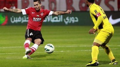 Luis Antonio Jiminez of Al Ahli scores his side's first goal during a match against Al Wasl at Rashid Stadium in Dubai on Monday. Jake Badger for The National