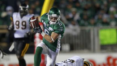 Saskatchewan Roughriders Rob Bagg heads up field after avoiding a tackle by Hamilton Tiger-Cats Emanuel Davis. Todd Korol / Reuters