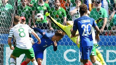 France forward Antoine Griezmann heads the ball to score the equalising goal. Franck Fife / AFP