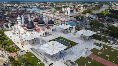 Worshippers arrive for Friday prayers at Baiturrahman Grand Mosque, in Banda Aceh, Indonesia. AFP