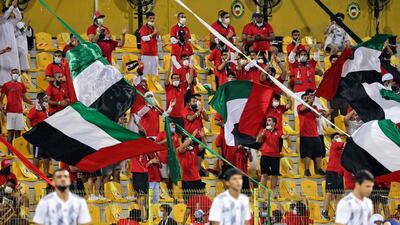 UAE fans cheer on the national team inside the Zabeel Stadium during the 2022 World Cup qualifier against Lebanon. AFP
