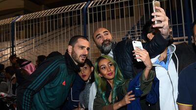 Leonardo Bonucci of Juventus signing autographs and taking selfies. Getty