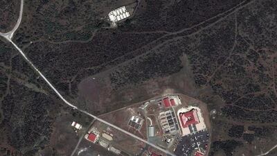 This satellite image shows a portion of Naval Station Guantanamo Bay, Cuba, including the secret facility known as Penny Lane, upper middle in white, where prisoners were turned into double agents and released. TerraServer.com and DigitalGlobe via AP