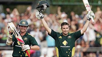 Australia's Shaun Marsh celebrates his 100th run in Hobart.