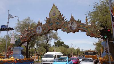A Thai worker cleans a road ahead of the coronation. AP Photo