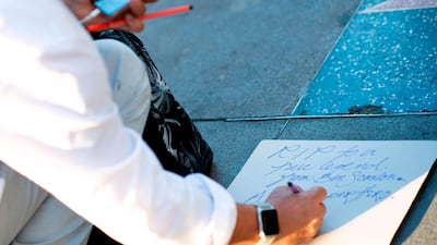 Fans write tributes for Stan Lee at his star on the Hollywood Walk of Fame. AFP