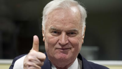 Bosnian Serb military chief Ratko Mladic shows a thumb up, as he enters the Yugoslav War Crimes Tribunal for the verdict hearing in his genocide trial, in The Hague, Netherlands. Peter Dejong / EPA