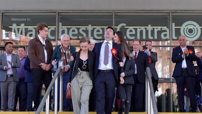 Burnham celebrates winning the Greater Manchester mayoral election with wife Marie-France van Heel and daughter Annie at Manchester Central in May 2017. Getty Images