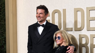 Bradley Cooper, in custom Louis Vuitton, with his mother Gloria Campano. Reuters